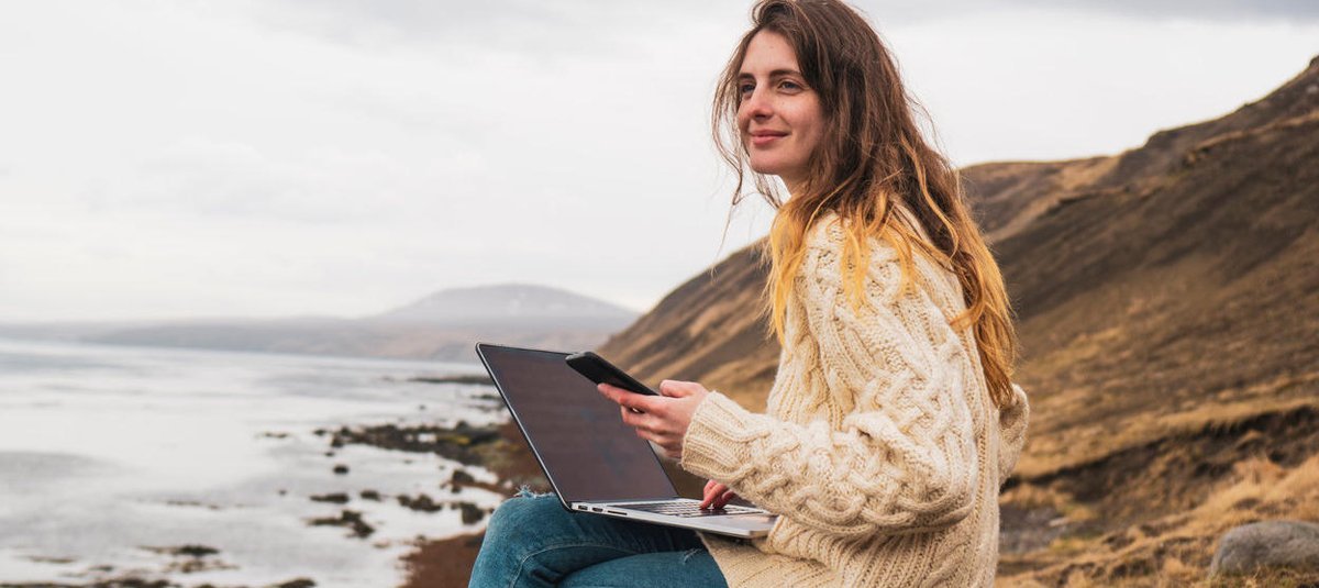 girl-working-on-laptop-at-hill-station